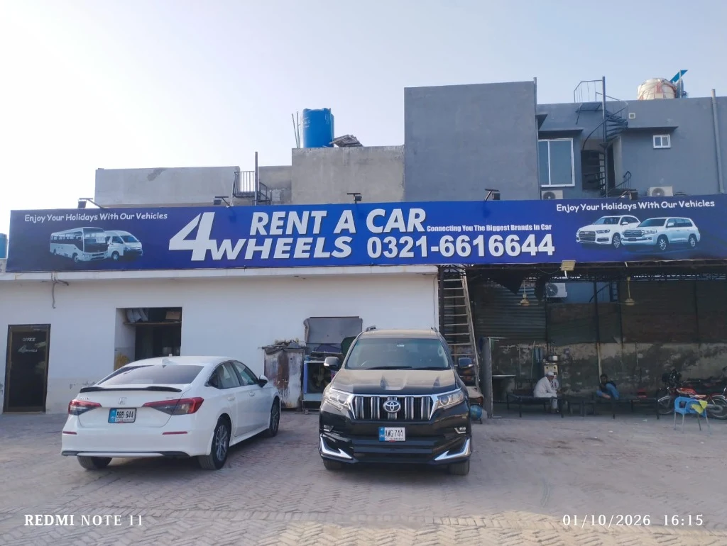 4WHEELS Customer Reception Entrance with Black Prado and White Civic